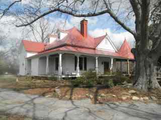Repair of tin shingles dating to earliest period Carolina homestead with 1870s tin shingles