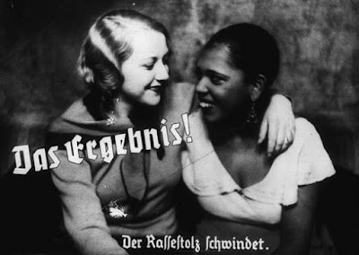 Nazi propaganda photo depicts friendship between an "Aryan" and a black woman. The caption states: "The result! A loss of racial pride." Germany, prewar. — US Holocaust Memorial Museum