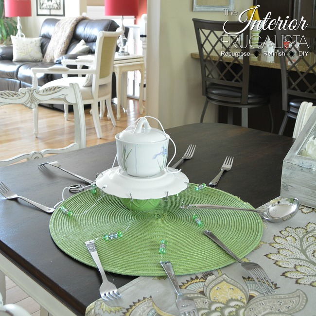 In step 5 of the DIY Silverware Wind Chimes we are stringing the colored beads and hanging the cutlery from the dessert plate by Interior Frugalista DIY Silverware Wind Chimes Step 5