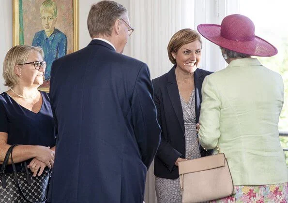 Princess Benedikte attended a lunch with the Danish Consul General in Flensburg. pearls earring and pearl necklace. Crown Princess Mary