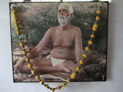Ramana Maharshi sitting cross legged