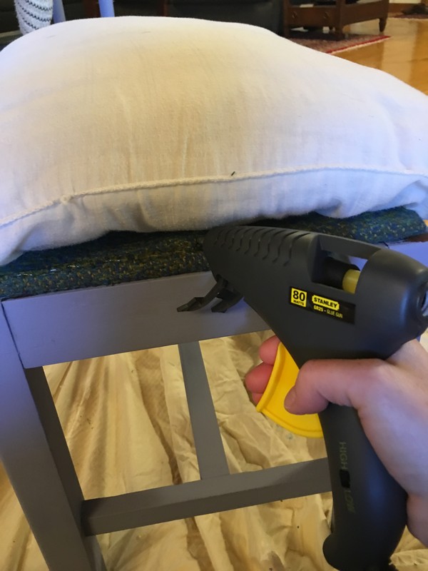 Use an old bed pillow and follow these steps for a super cheap DIY no-sew bench cushion! 