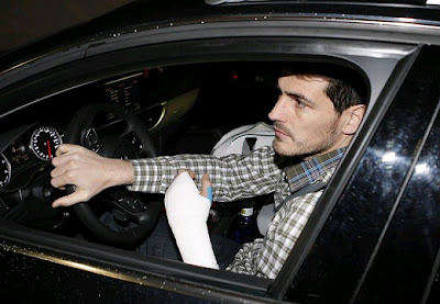 Casillas wearing a visible bandage on his left hand