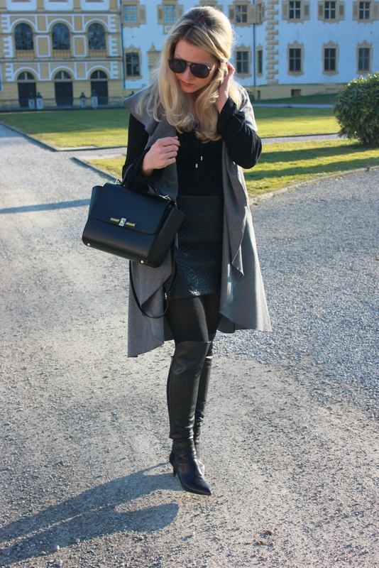 fleurani: leather overknee boots; sleveless vest; black outfit