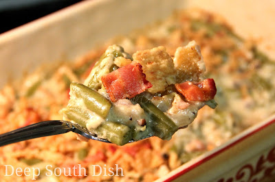 Green Bean Casserole made with a homemade, butter roux based cream sauce, enhanced with bacon, fresh vegetables and mushrooms.