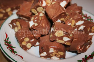 Rocky Road Candy Squares, made from chocolate chips, condensed milk, chopped peanuts and marshmallows.
