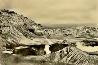 The same crater in September 1904.  The eruption has almost completely died down.  The boiling crater lake is shown on the right of the active cone.