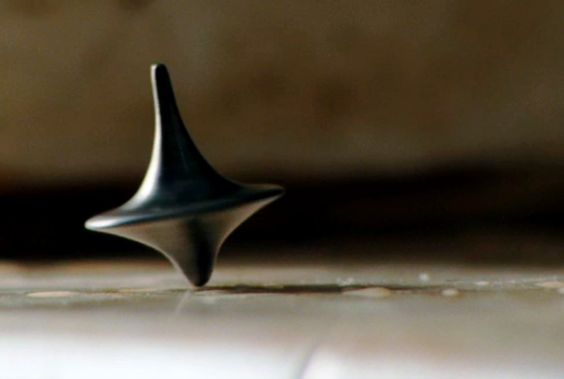 Mastermind Productions Inception Mise En Scene Throughout Inception Referring To A Table Top Spinner Is Common Occurrence When The Prop First Used It Has No Significance Towards Aunce