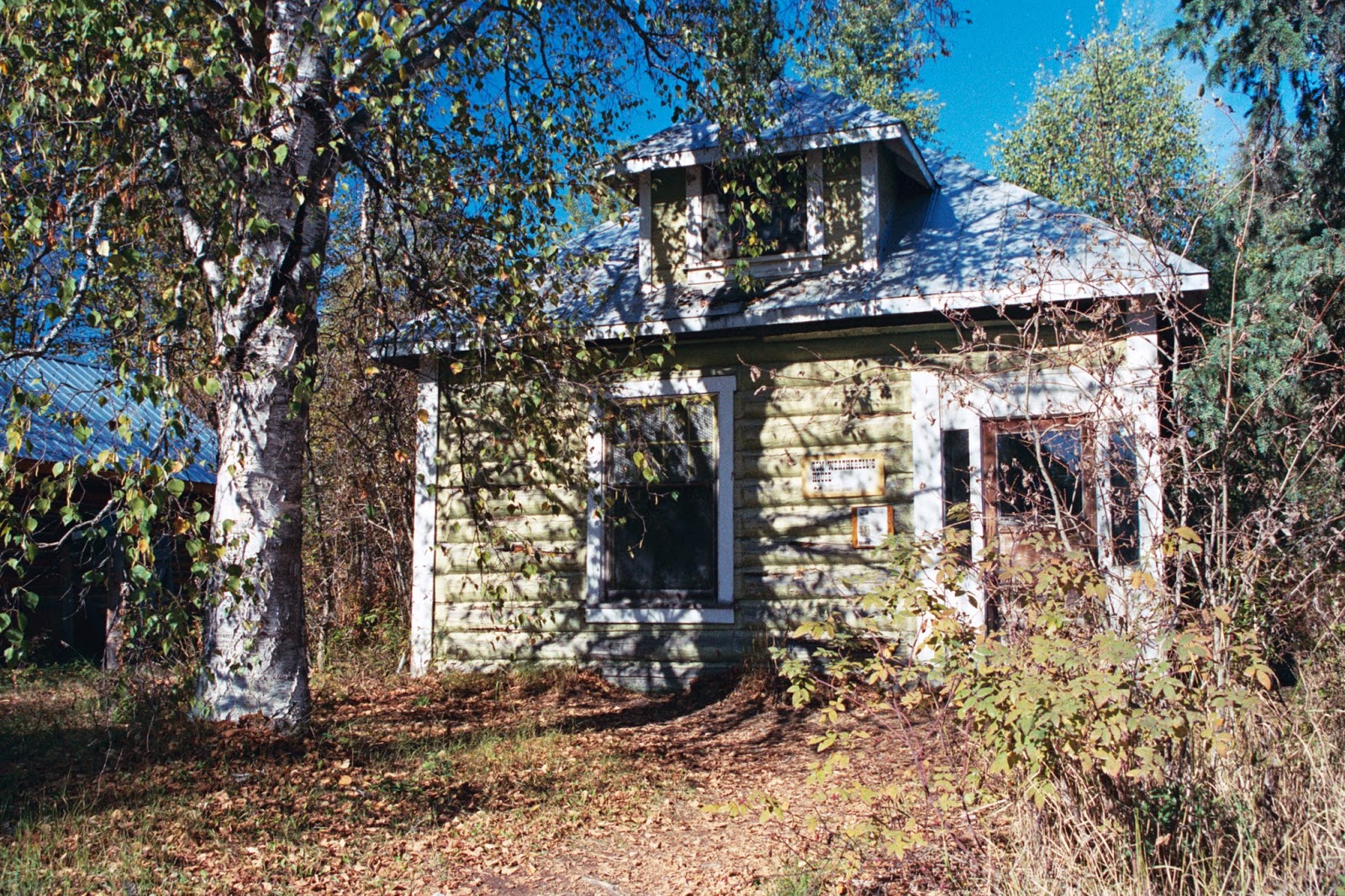Tom Weatherbell's historic log cabin in Talkeetna, Alaska shows railroad influence. Log cabin in historic Alaska riverfront village