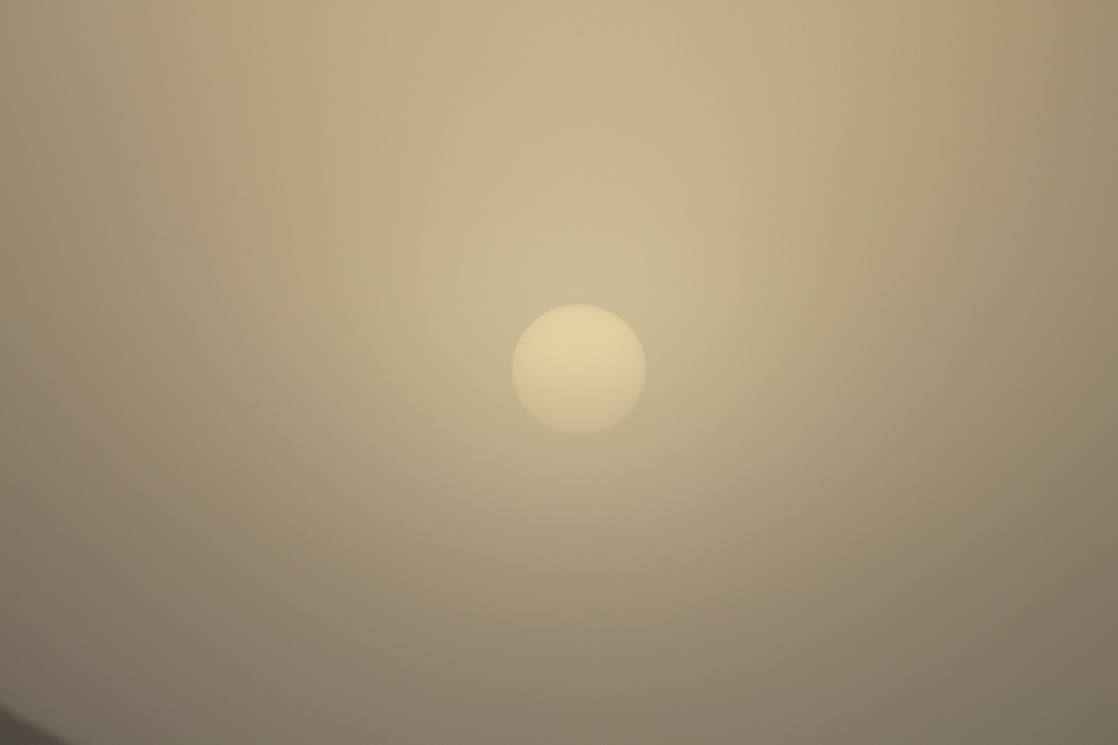 yellow sun through fog