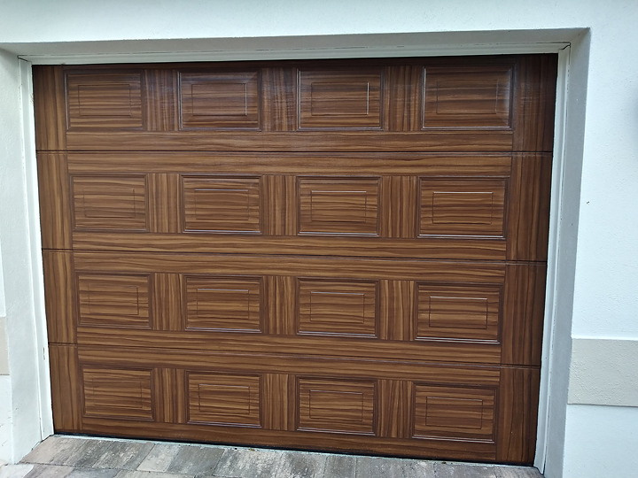 Project To Paint Garage Doors To Look Like Wood Is Complete