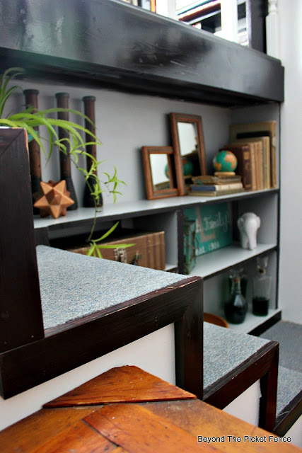 style a bookshelf with vintage finds
