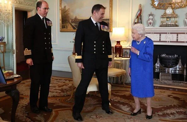Queen Elizabeth II received the outgoing and incoming Commanding Officers of HMS Queen Elizabeth