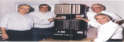 The picture shows some PLC Pioneers posing with the MODICON 084