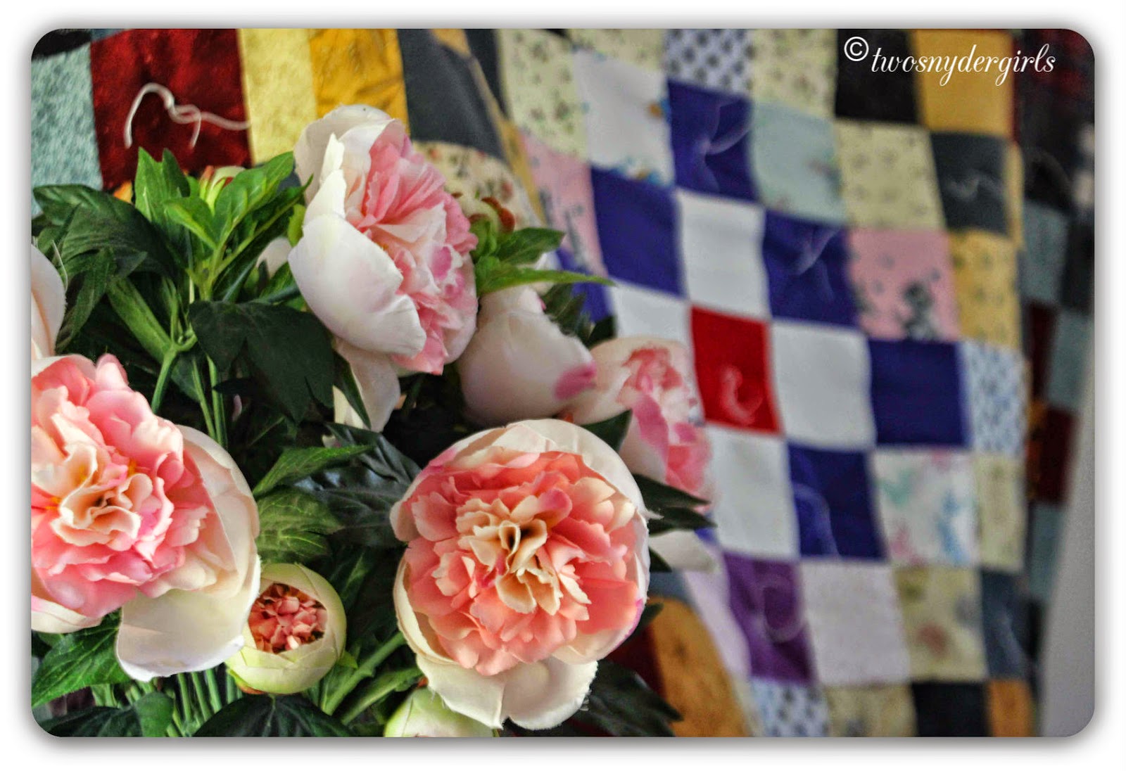 Pink peonies against a quilt Pink peonies against a quilt