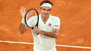 Federer makes triumphant return to clay in Madrid