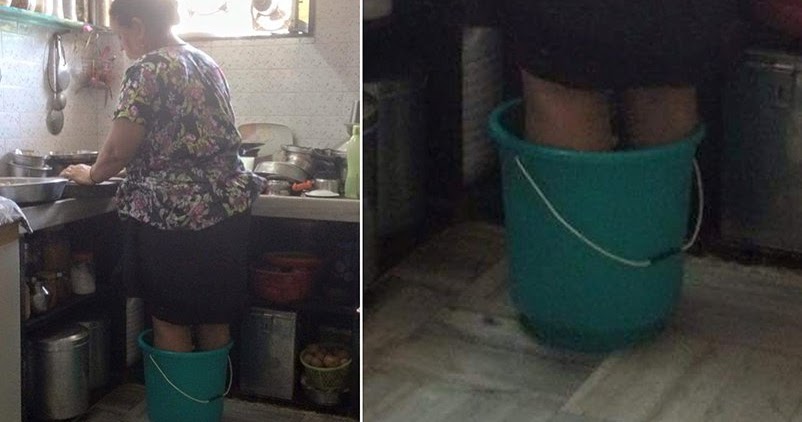 Despite Of Deep Pain In Legs A Mother Stands In Hot Water Bucket Just