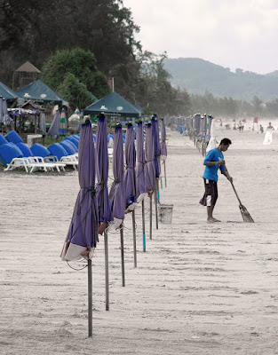 Sweeping up at Karon Beach