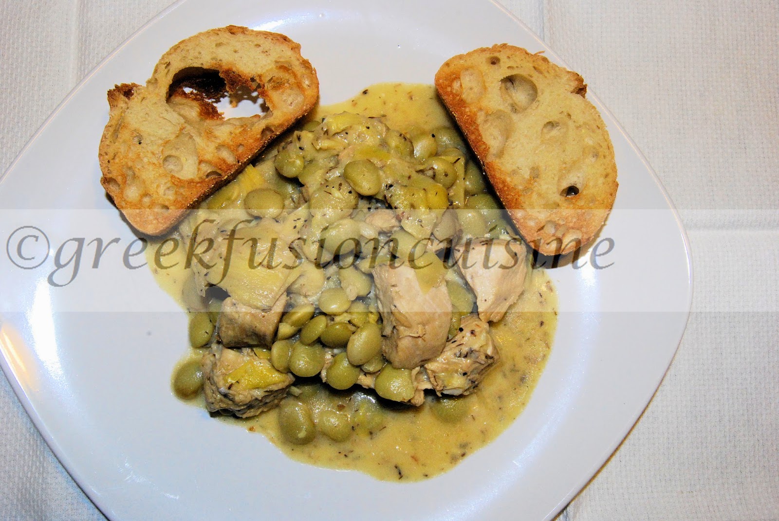 Greek Fusion Cuisine Chicken with lima beans and artichoke hearts in