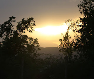 The sun descends below cloud level The sun descends below cloud level