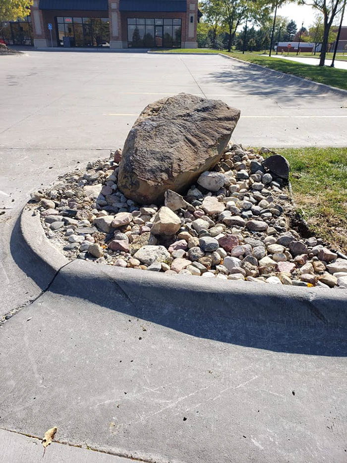 Someone Placed A Giant Stone To Prevent Drivers From Cutting The Corner, And The Results Were Hilarious