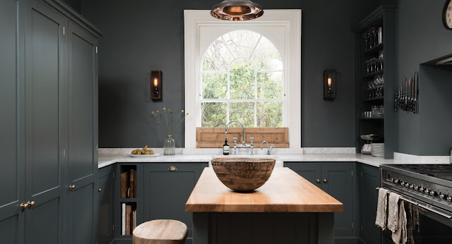 Dark blue-grey cabinets and walls in a luxurious classic London kitchen - found on Hello Lovely Studio