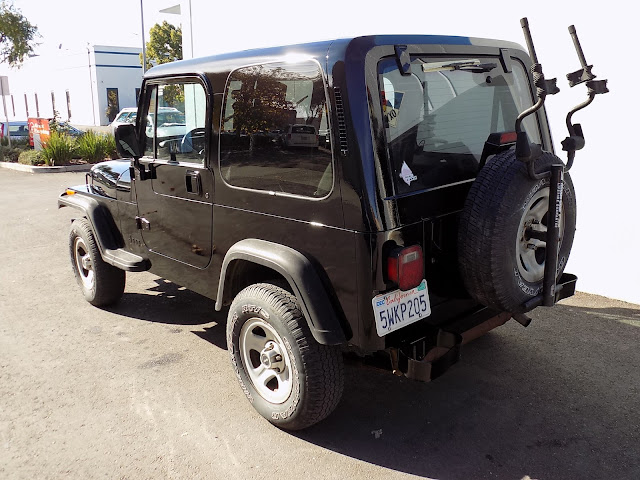 Faded Jeep Wrangler after repainting at Almost Everything Auto Body.