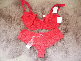 luxury red bra and knicker set on fur rug 