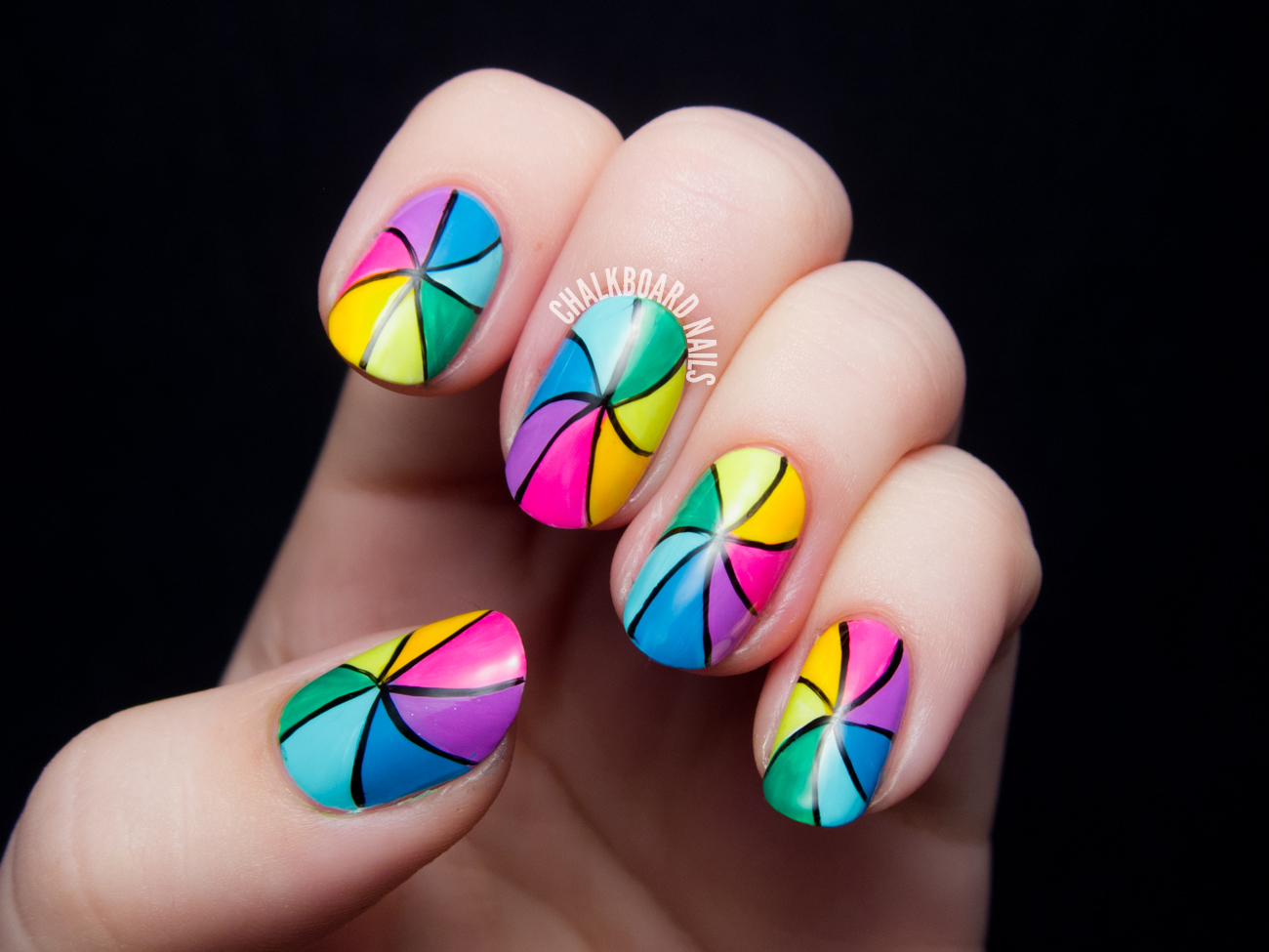Rainbow pinwheel nail art by @chalkboardnails