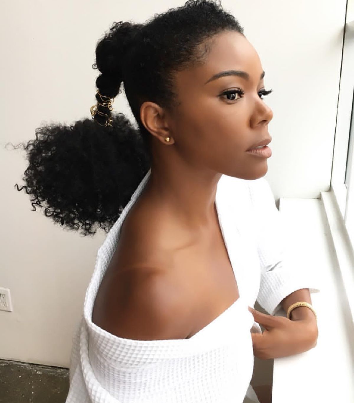 Gabrielle Glows with Ponytail Wrapped in Braid Jewelry
