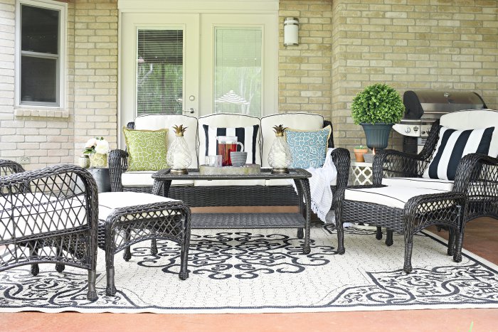 Outdoor patio set and decor in a beautiful brown and beige/ivory color palette with pops of color. | via monicawantsit.com