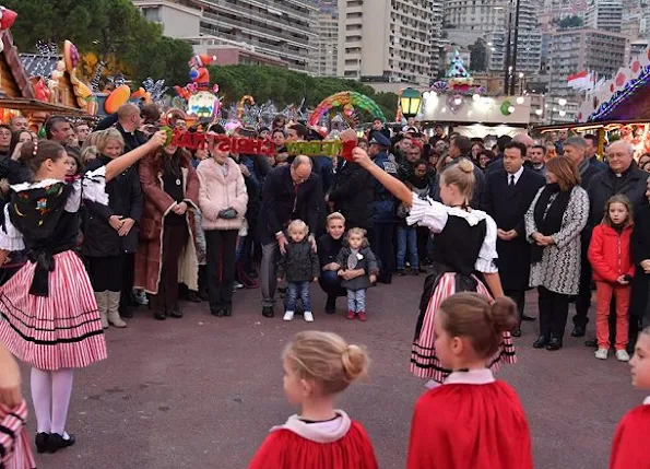 Princess Charlene, Princess Gabriella at opening the Monaco Christmas Village in Monaco. Style of Princess Charlene