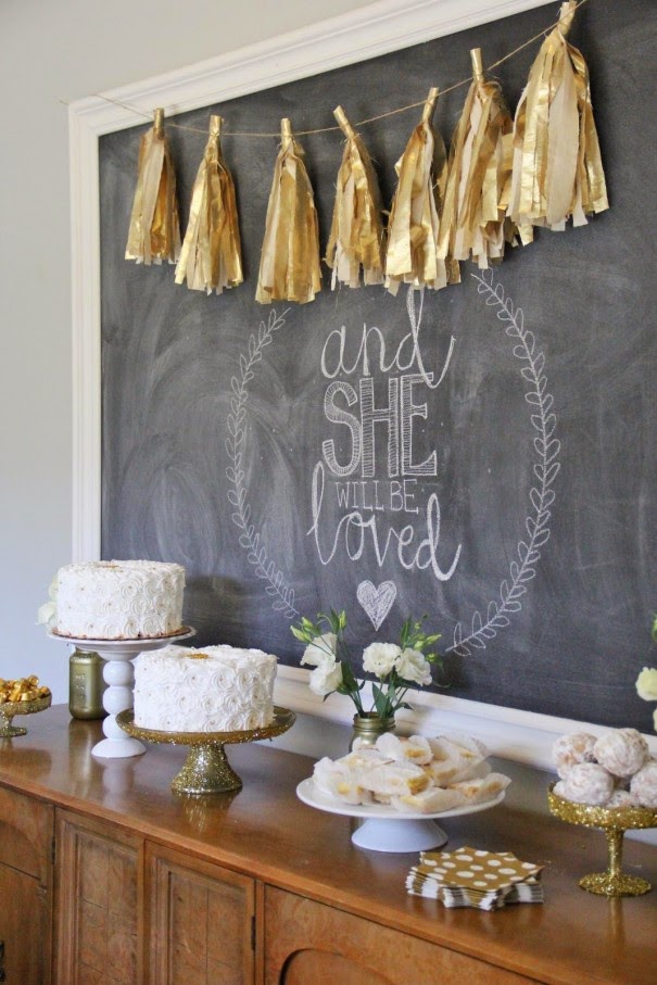 dessert table white and gold, with tassel garland and cute background
