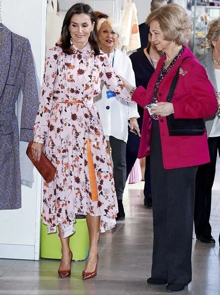 Queen Letizia wore a new floral print midi shirtdress by Hugo Boss at charity market Rastrillo Nuevo Futuro. Queen Sofia