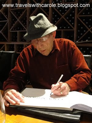 Jim Concannon signs his book at the Underdog Wine Bar in Livermore, California