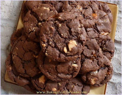 Treat Filled Cookies, a rich chocolate cookie with a few surprise treats baked in | Recipe developed by www.BakingInATornado.com | #recipe #cookies #chocolate