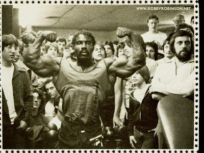 ROBBY ROBINSON ON TOUR - FRONT DOUBLE BICEPS - NEW YORK CITY 70'S Read about RR's training and life experience, about other legends of Golden Era  of bodybuilding and what really happened behind the scenes of Weider's empire  in RR's BOOK "The BLACK PRINCE; My Life in Bodybuilding: Muscle vs. Hustle"   ● www.robbyrobinson.net/books.php ● 