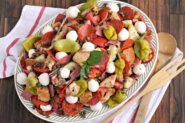 Two classic Italian salads are combined into one in this delicious Antipasto Panzanella Salad that's perfect for backyard BBQ's & potlucks.