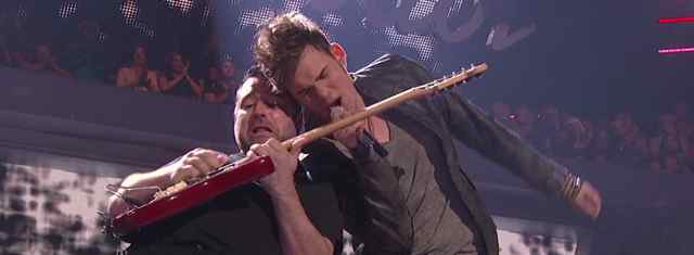 American Idol Guitar Player Tony Pulizzi rips a solo as James Durbin sings