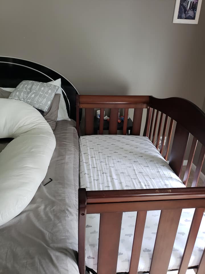 crib connected to bed