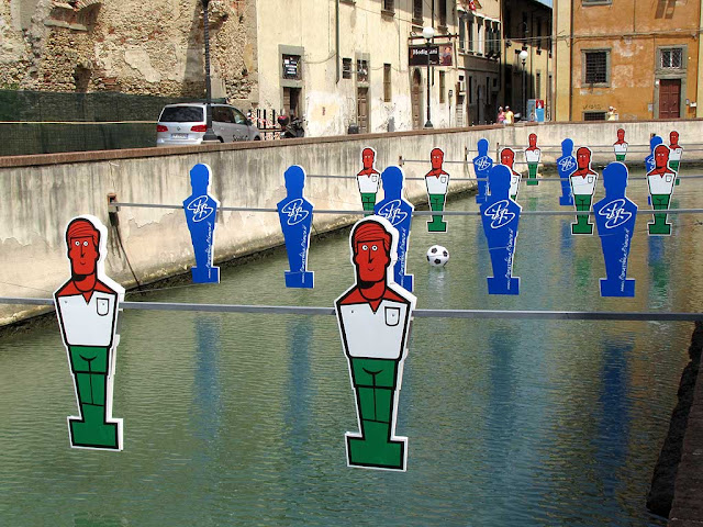 Giant table football in a canal, Livorno