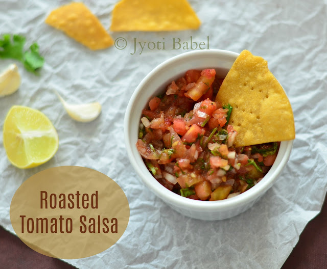 Roasted Tomato Salsa is one of the must accompaniments with tortilla chips. A medley of chopped roasted tomatoes, onions, chillies, coriander, spices and lemon juice makes for a lip-smacking dip. Recipe at www.jyotibabel.com