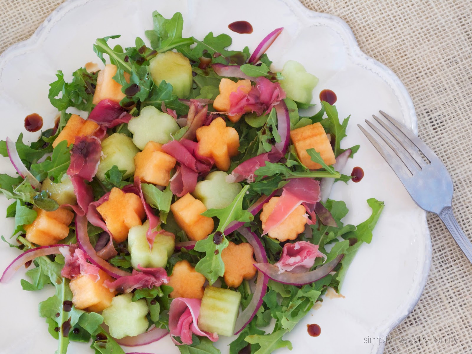 the beauty of sharing Melon and Prosciutto Arugula Salad with