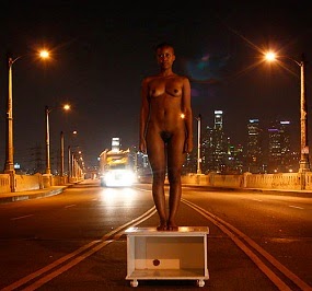 William Springfield: Girl on a coffee table on the highway.