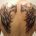Girl Showing Angel Wings Tattoos