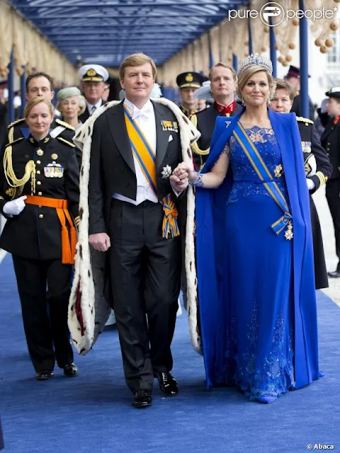 Dutch King Willem-Alexander and his wife Queen Maxima arrive to attend a religious ceremony at the Nieuwe Kerk church in Amsterdam