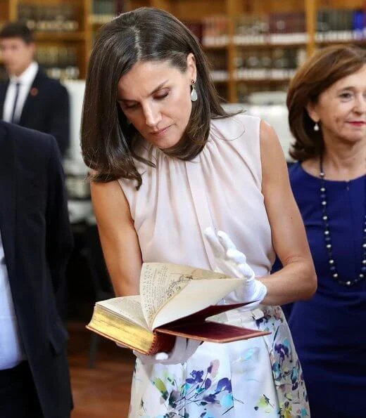 Queen Letizia wore Adolfo Dominguez floral print dress and Hugo Boss silk blouse, and Steve Madden pumps