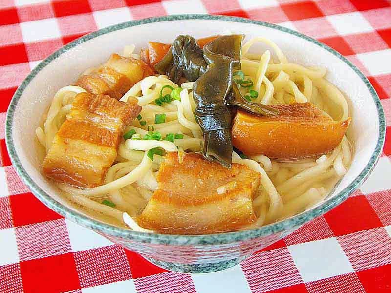 large bowl of Okinawa Soba, noodles and pork