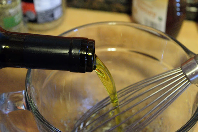 Extra Virgin Olive Oil being added to the mixing bowl.