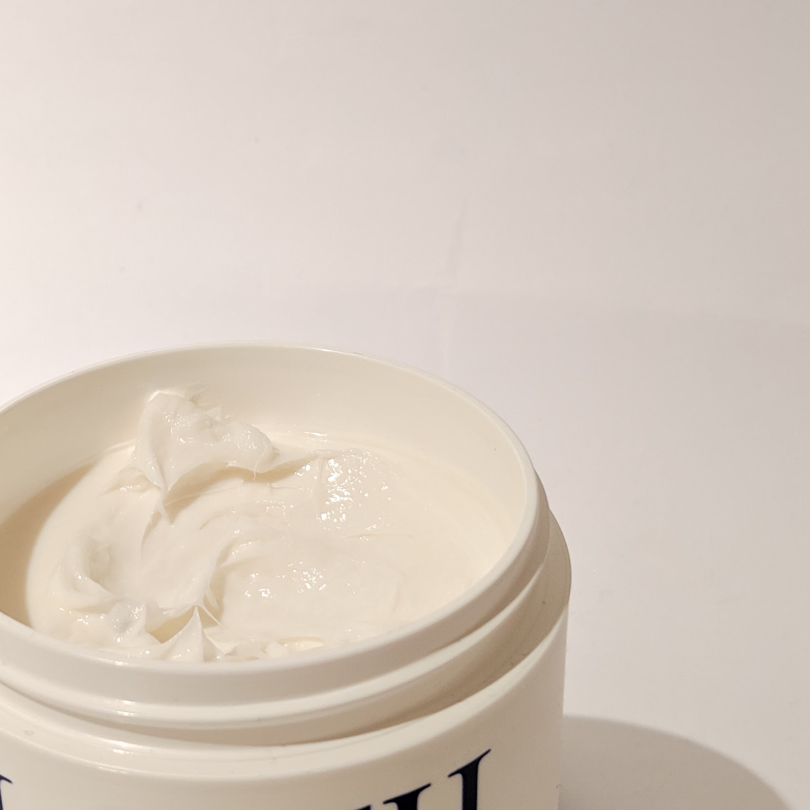 A close up image of a tub of Lotil Moisturising Cream